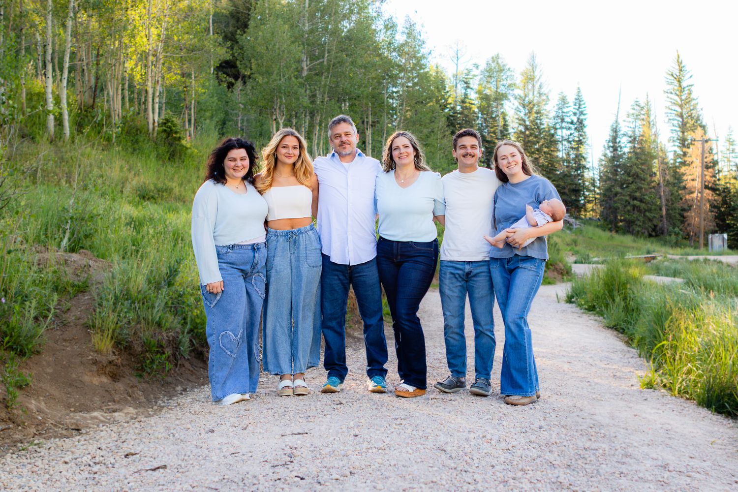 Family photos in Cedar City with forest vibe at Woods Ranch Park