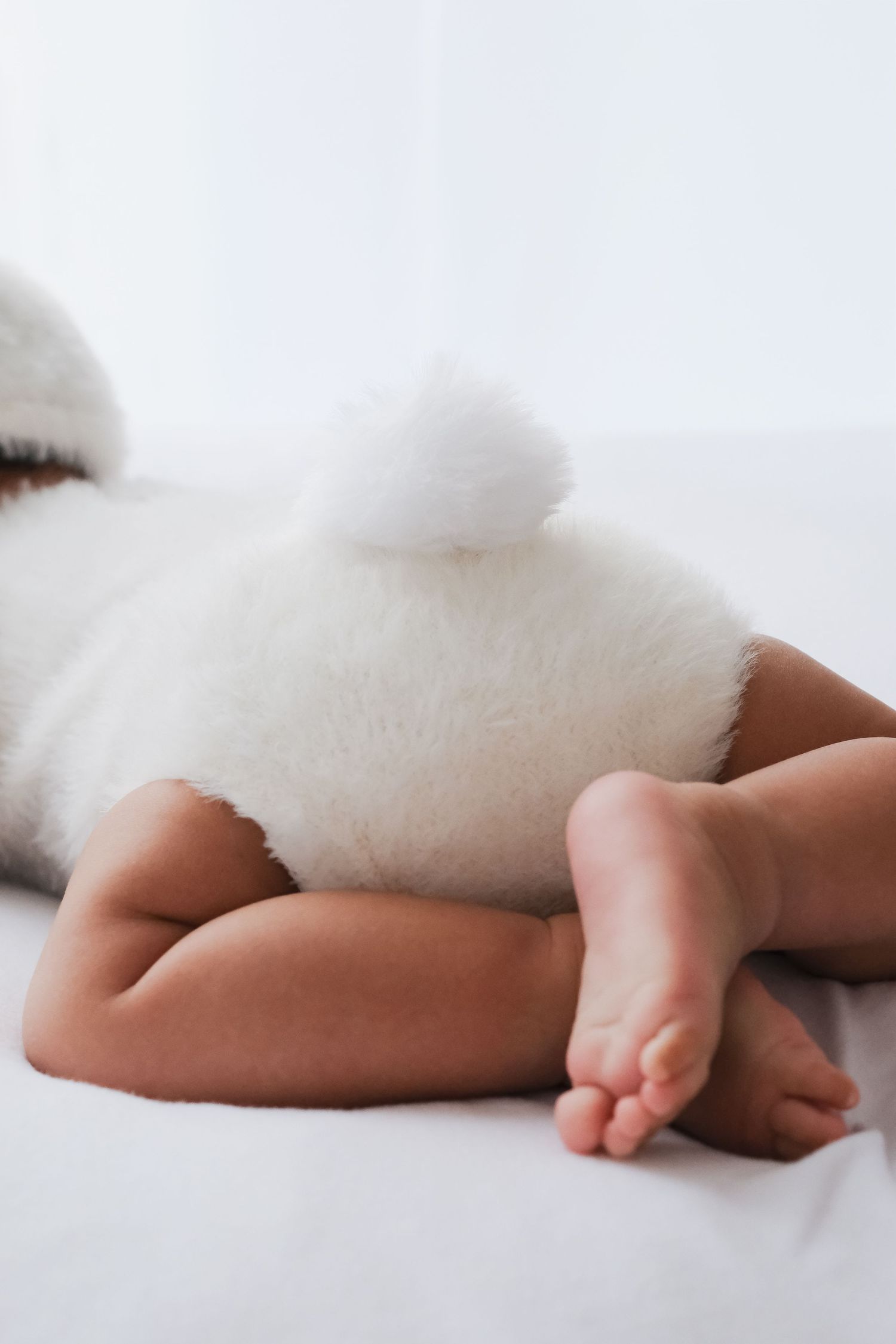 Close-up of a sleeping baby's tiny feet, white airy photography, newborn photoshoot, Newbury studio.