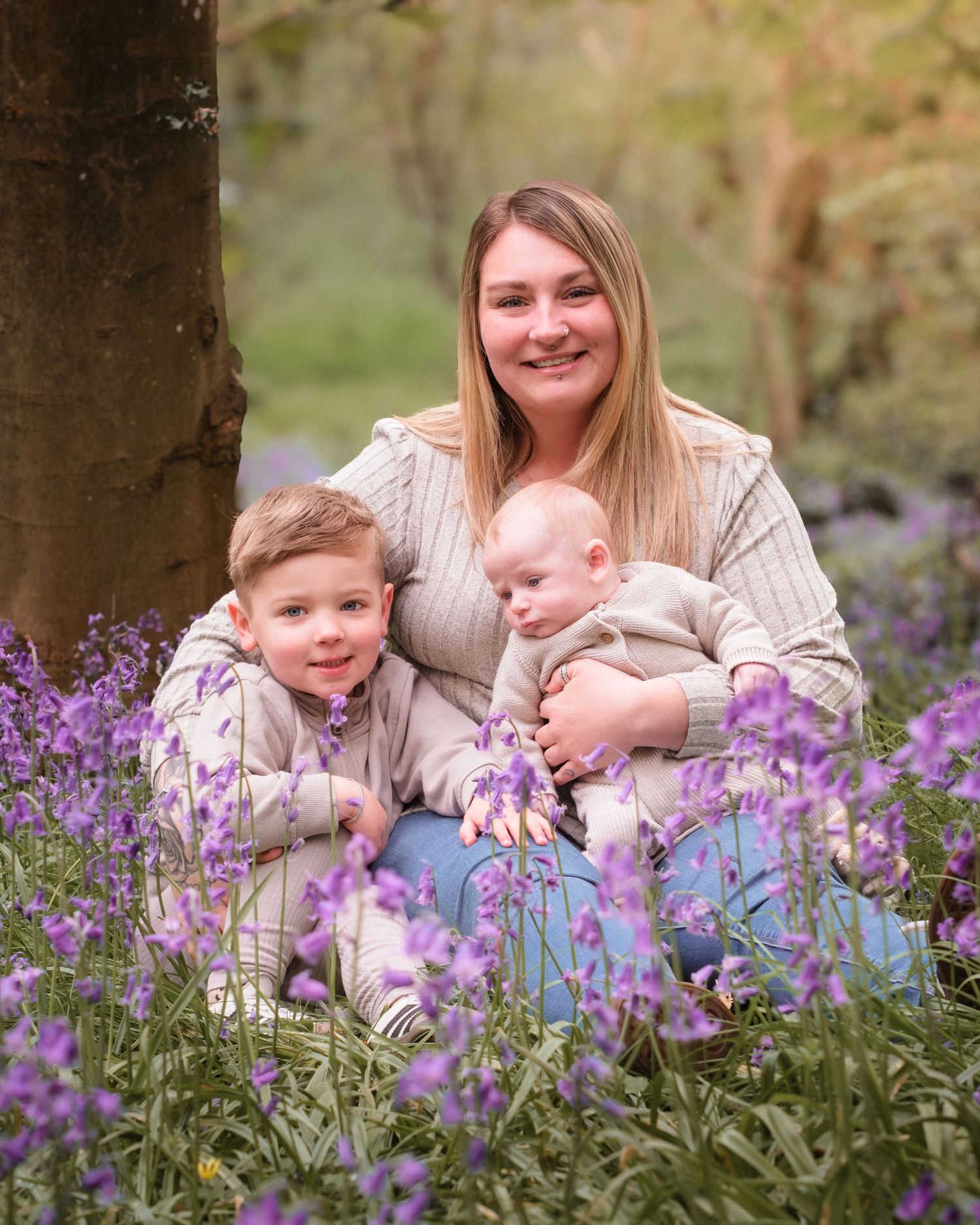 Mum and children amongst bluebells lovely moments family portrait Newbury photographer