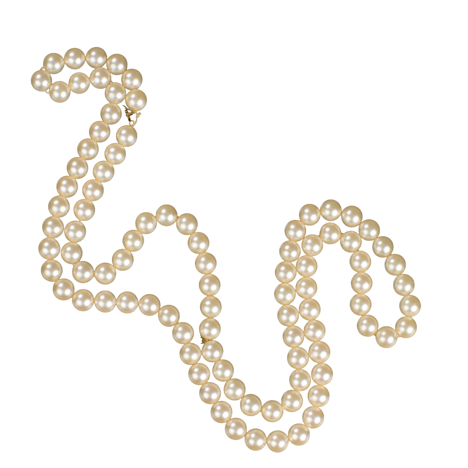 Long strand of classic cream pearl necklace arranged in elegant S-curve shape with gold clasp.