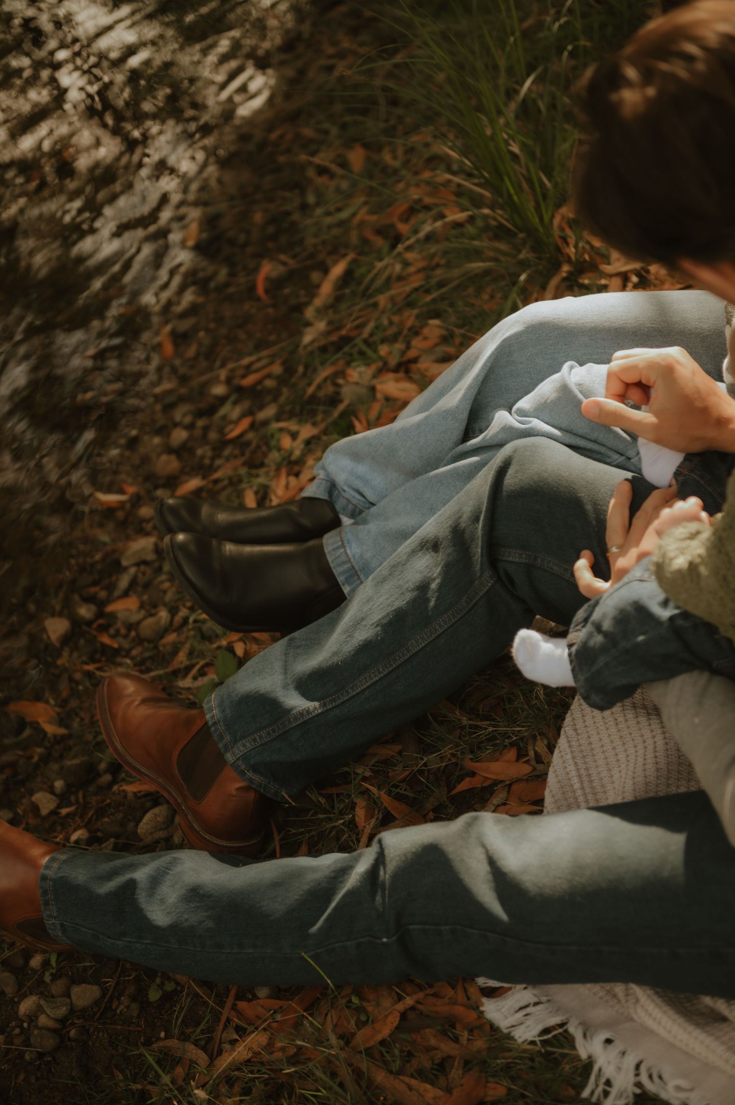 Relaxed family photography in Tasmania captured on a private farm near Hobart, featuring natural light and candid moments in open paddocks