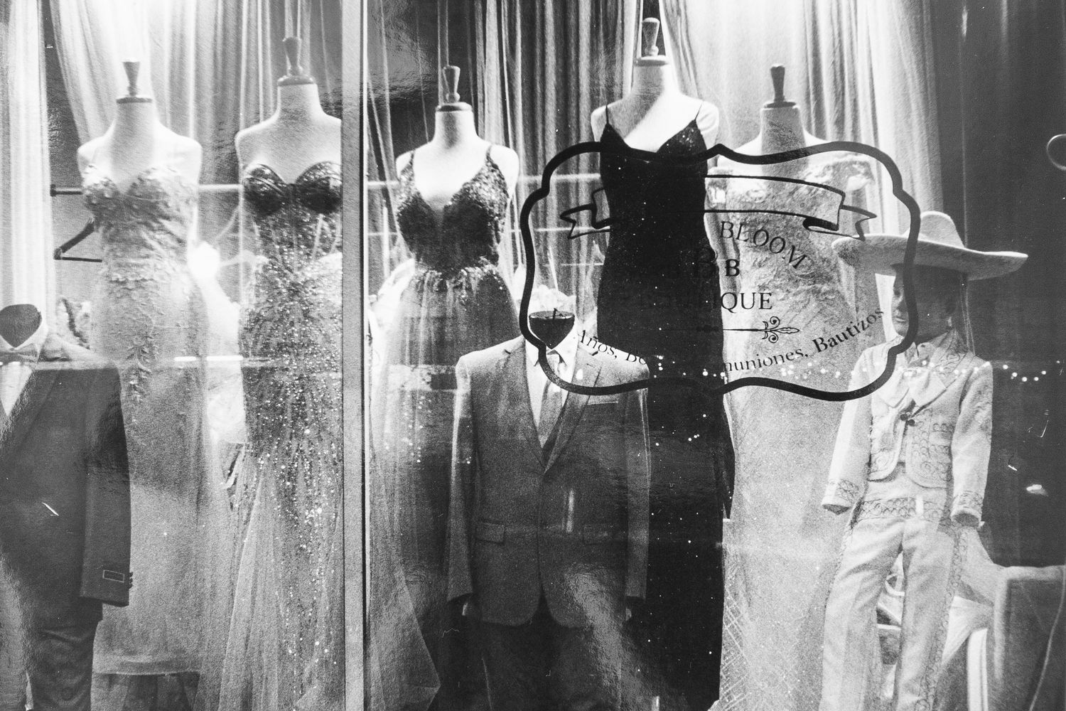 black and white silver gelatin print of dress shop storefront at night, Grand Ave., Escondido, CA