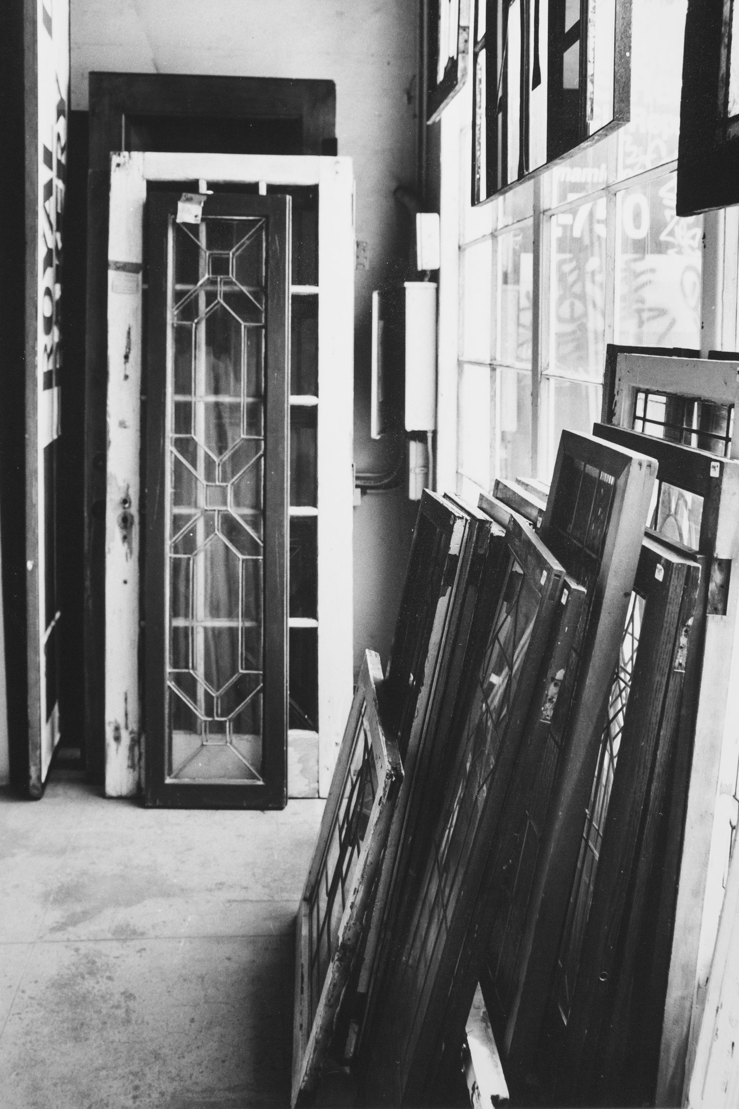 black and white silver gelatin print of salvaged stained glass windows for sale at Architectural Salvage, San Diego, CA