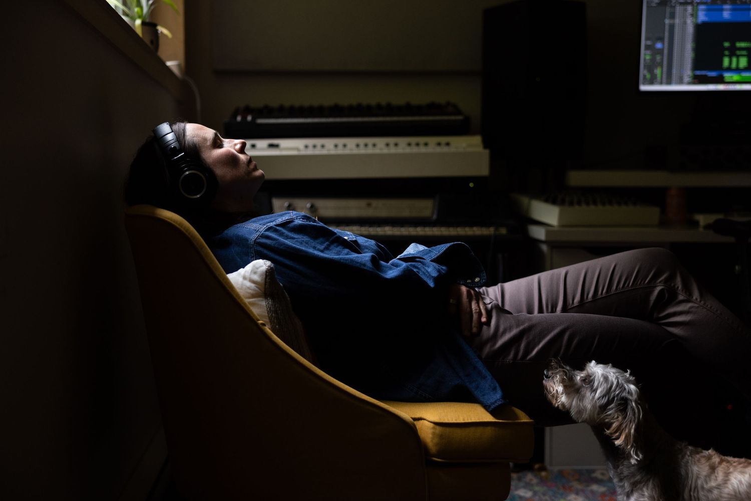 Juno-award winning singer-songwriter Rose Cousins listens to her new album while her dog watches. Documentary music photography