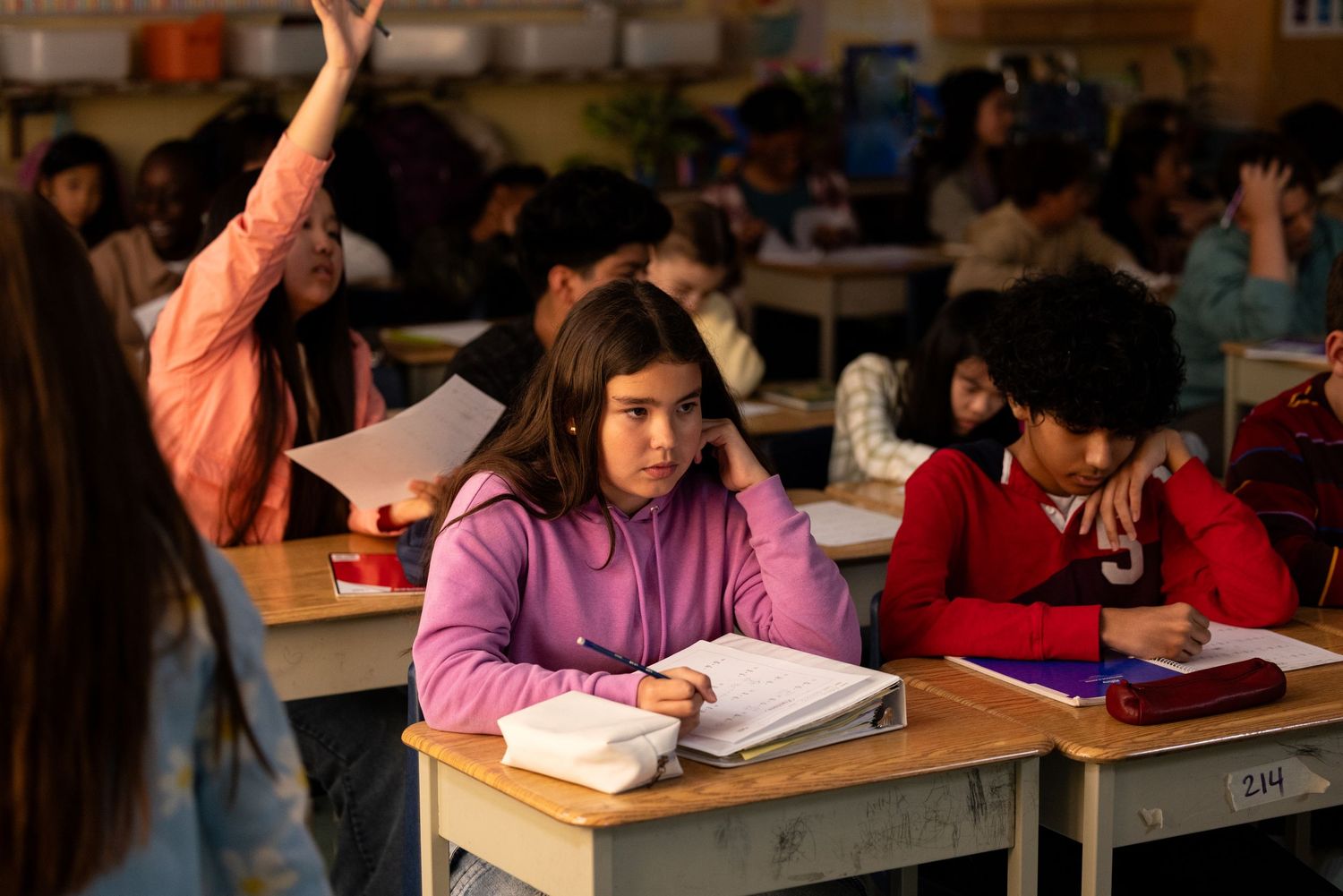 A student sits in a cramped classroom not learning due to large class sizes, a documentary style photoshoot for an education union