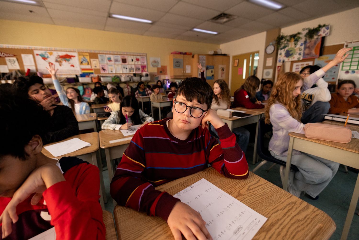A student sits in a cramped classroom not learning due to large class sizes, a documentary style photoshoot for an education union