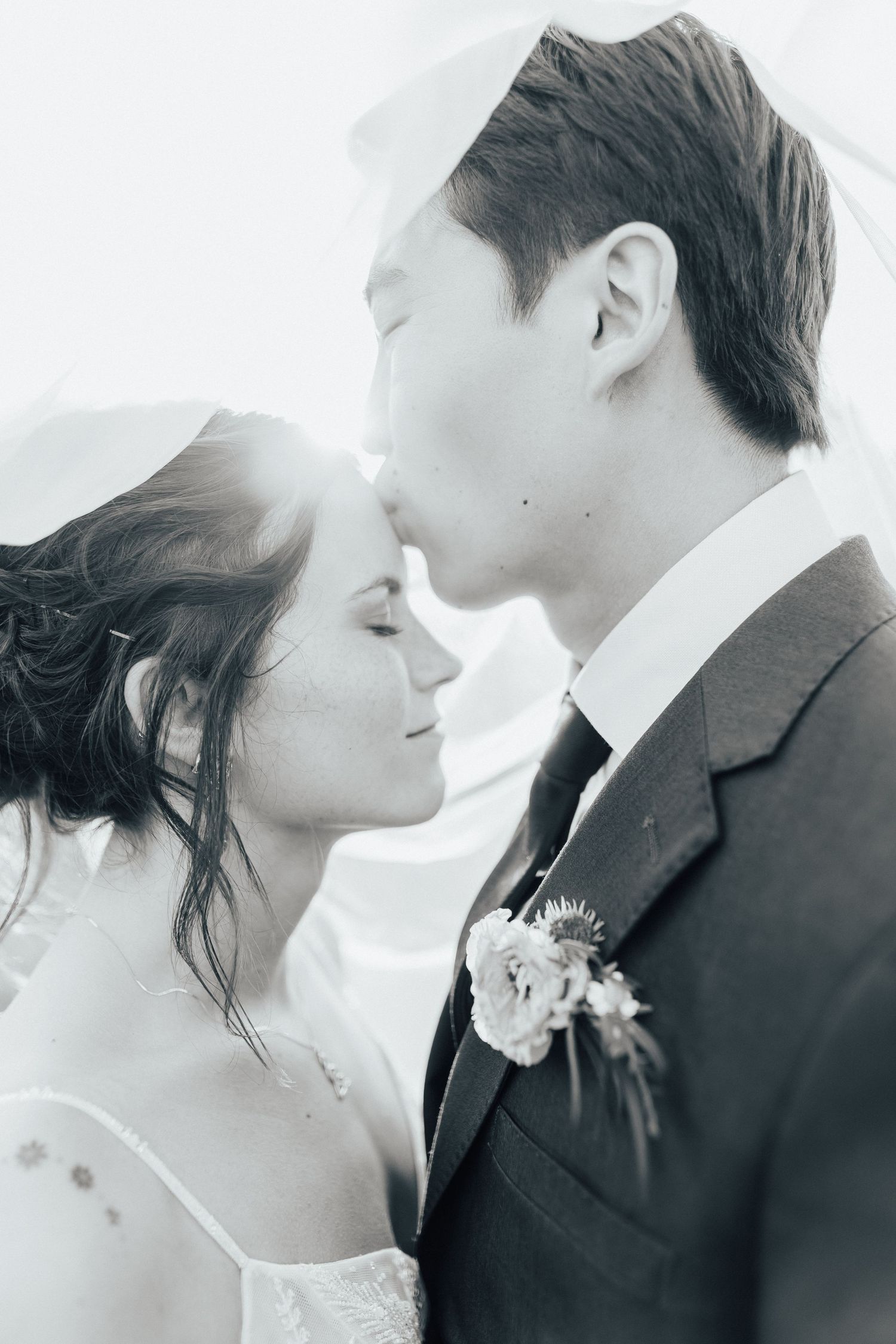 Intimate black and white wedding portraits showing tender romantic moments.