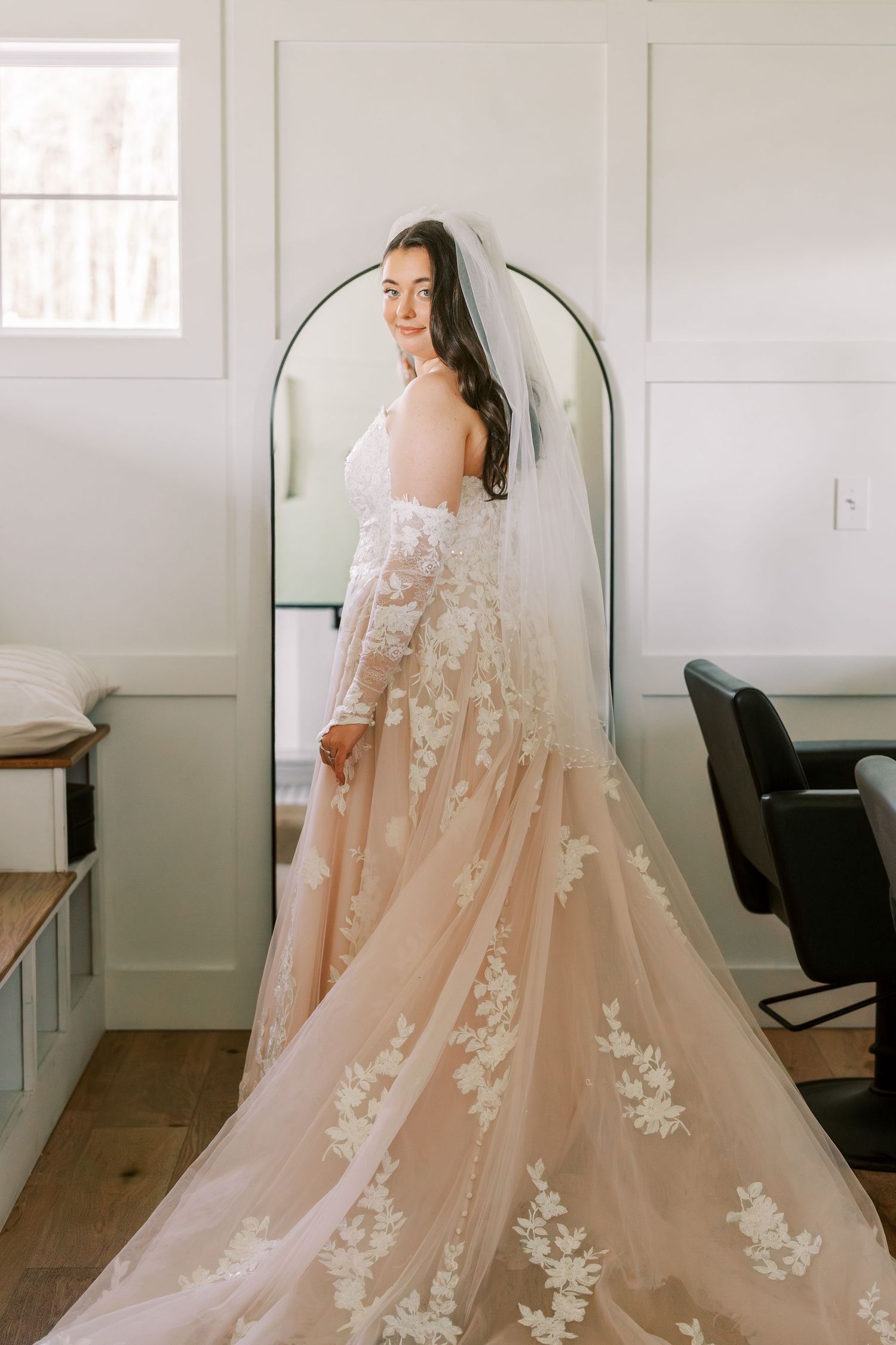 A romantic off-shoulder wedding gown with delicate floral lace appliques and flowing champagne tulle train shown in sequence.