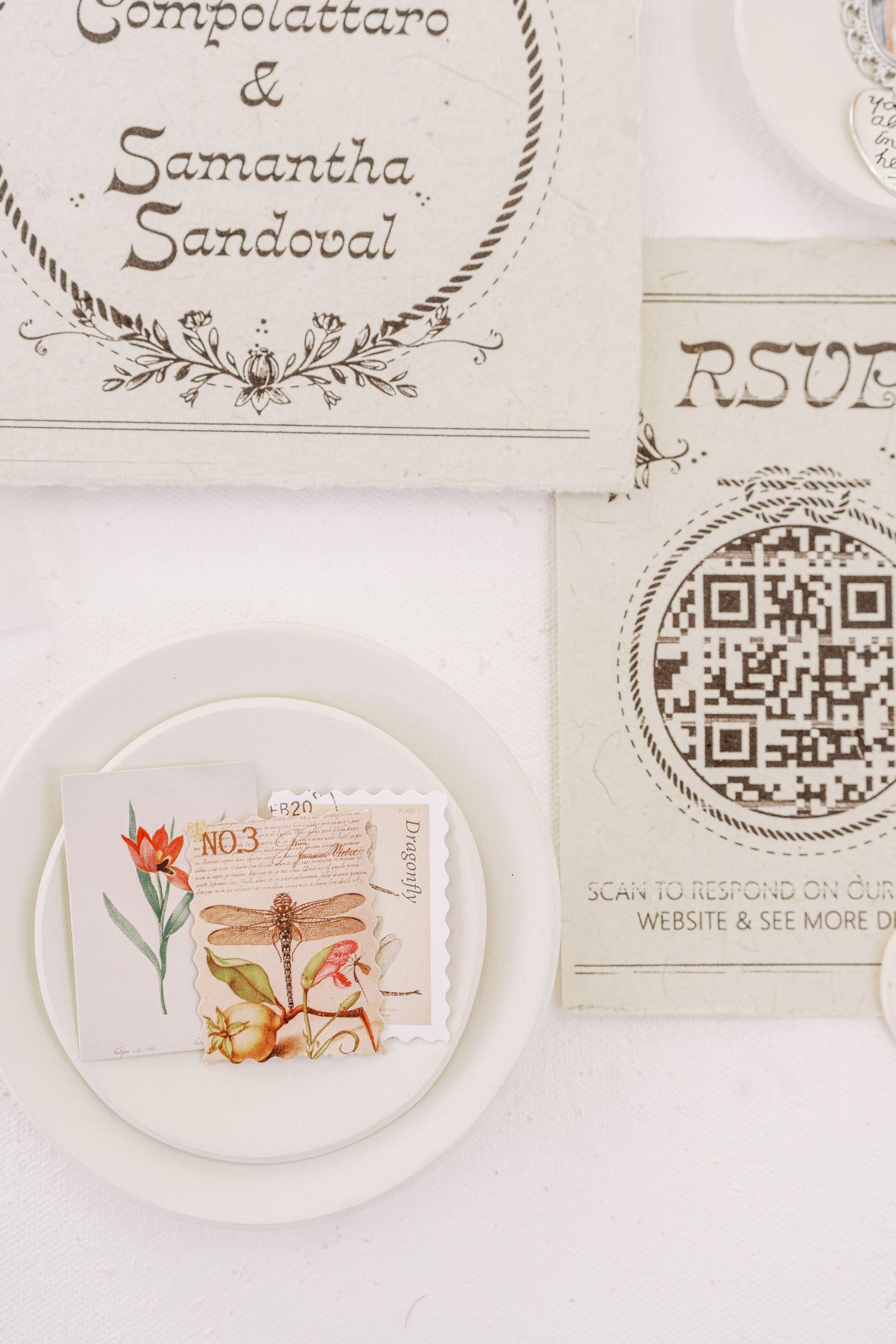 Elegant white plates with delicate watercolor floral illustrations arranged in a row on a light background.