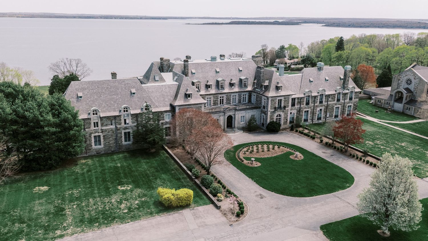 A panoramic aerial view of a residential neighborhood with townhouses and landscaped green spaces.