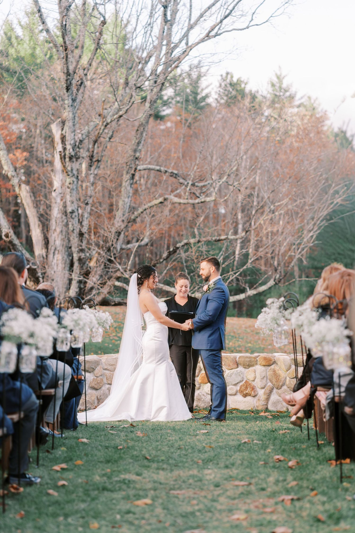 Sequence of outdoor wedding ceremony photos showing couple and guests in a rustic woodland setting during autumn.