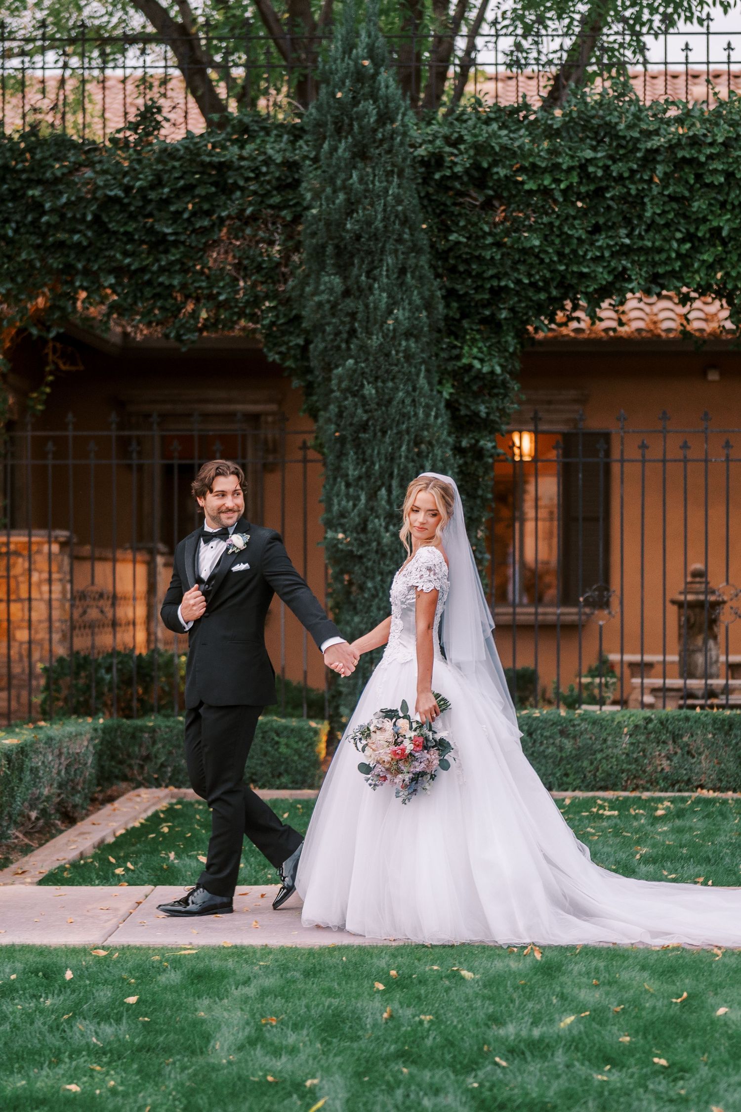 A romantic wedding photo sequence showing a couple in formal attire walking and posing together on a garden lawn.