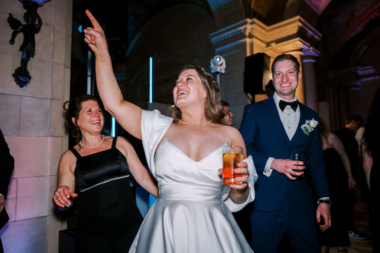 Guests enjoying themselves on a dance floor during a formal evening celebration.
