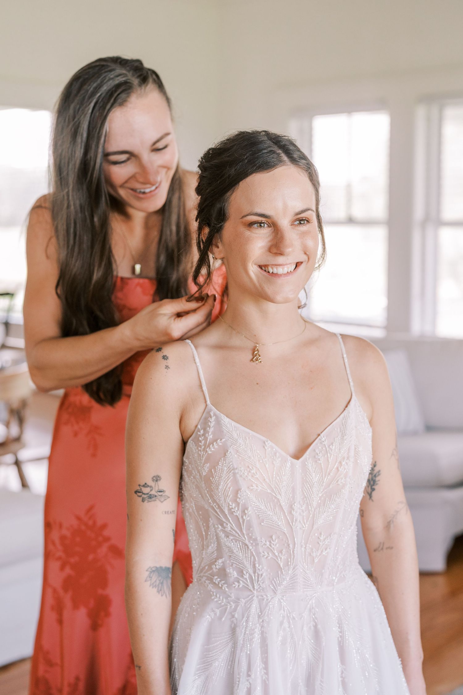 Final touches being made to bridal preparations with lace dress details.