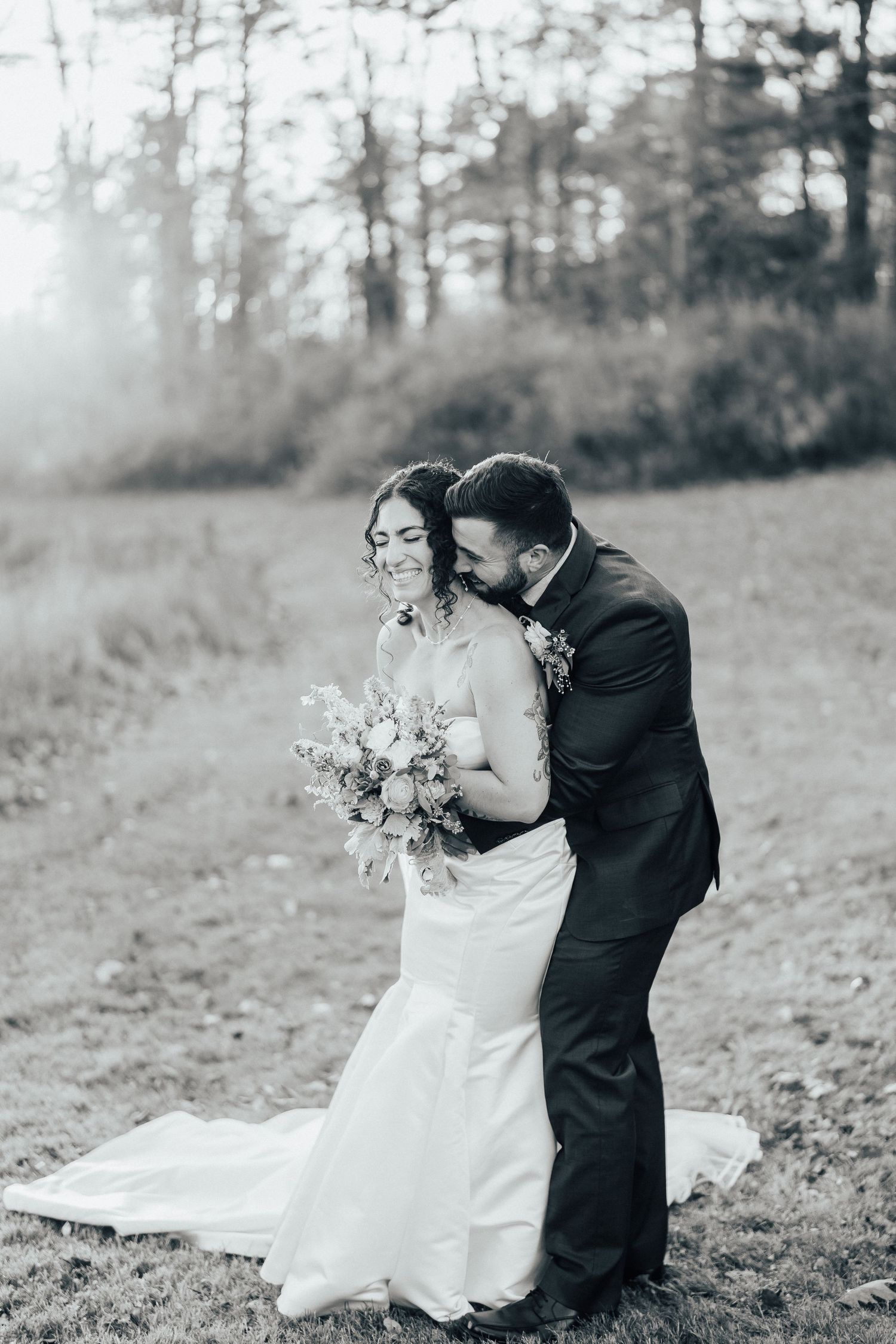 A romantic black and white wedding photo series showing tender moments between newlyweds in a natural outdoor setting.