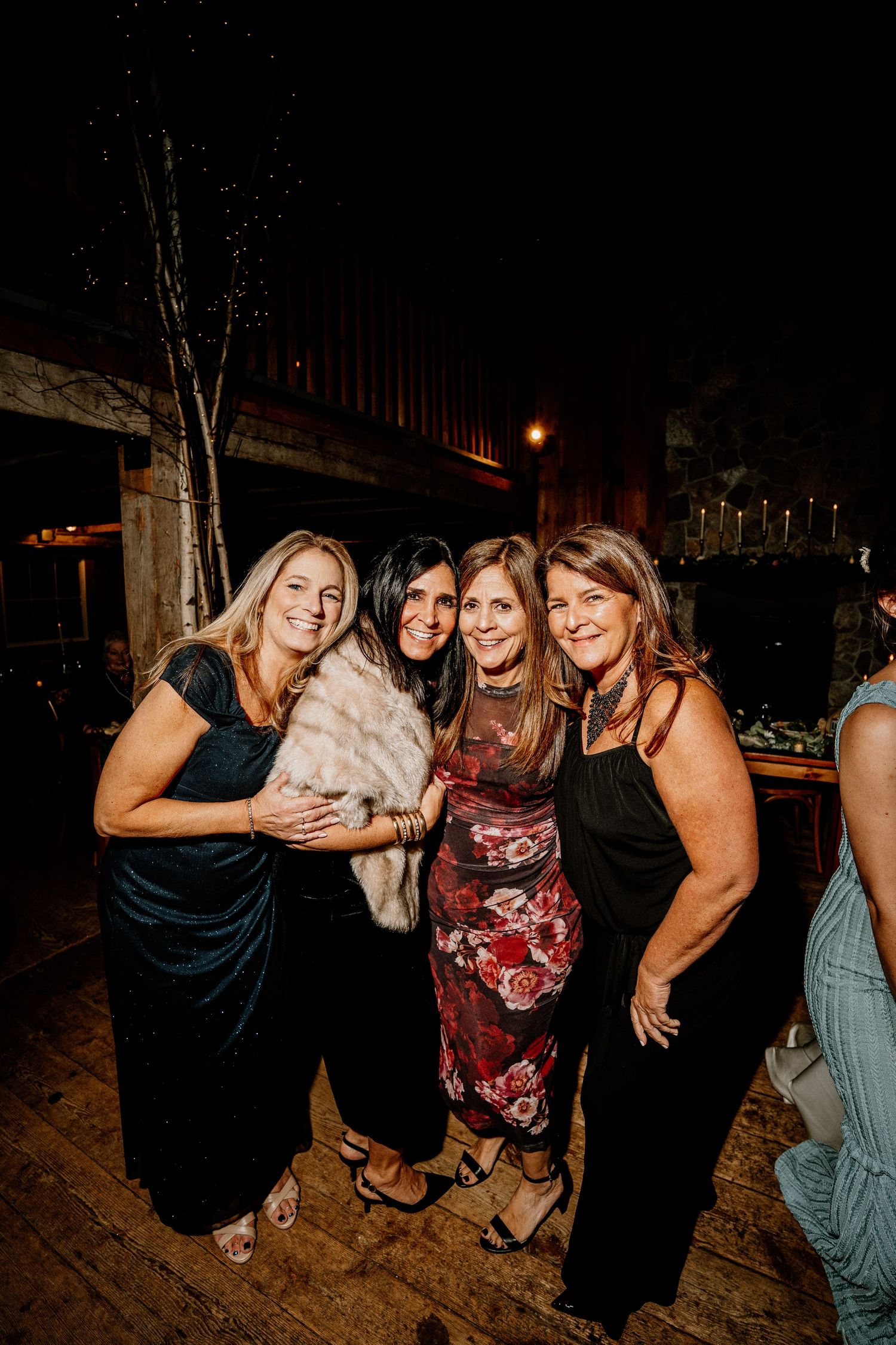 A group of friends enjoying a fun night out together at a dimly lit venue.