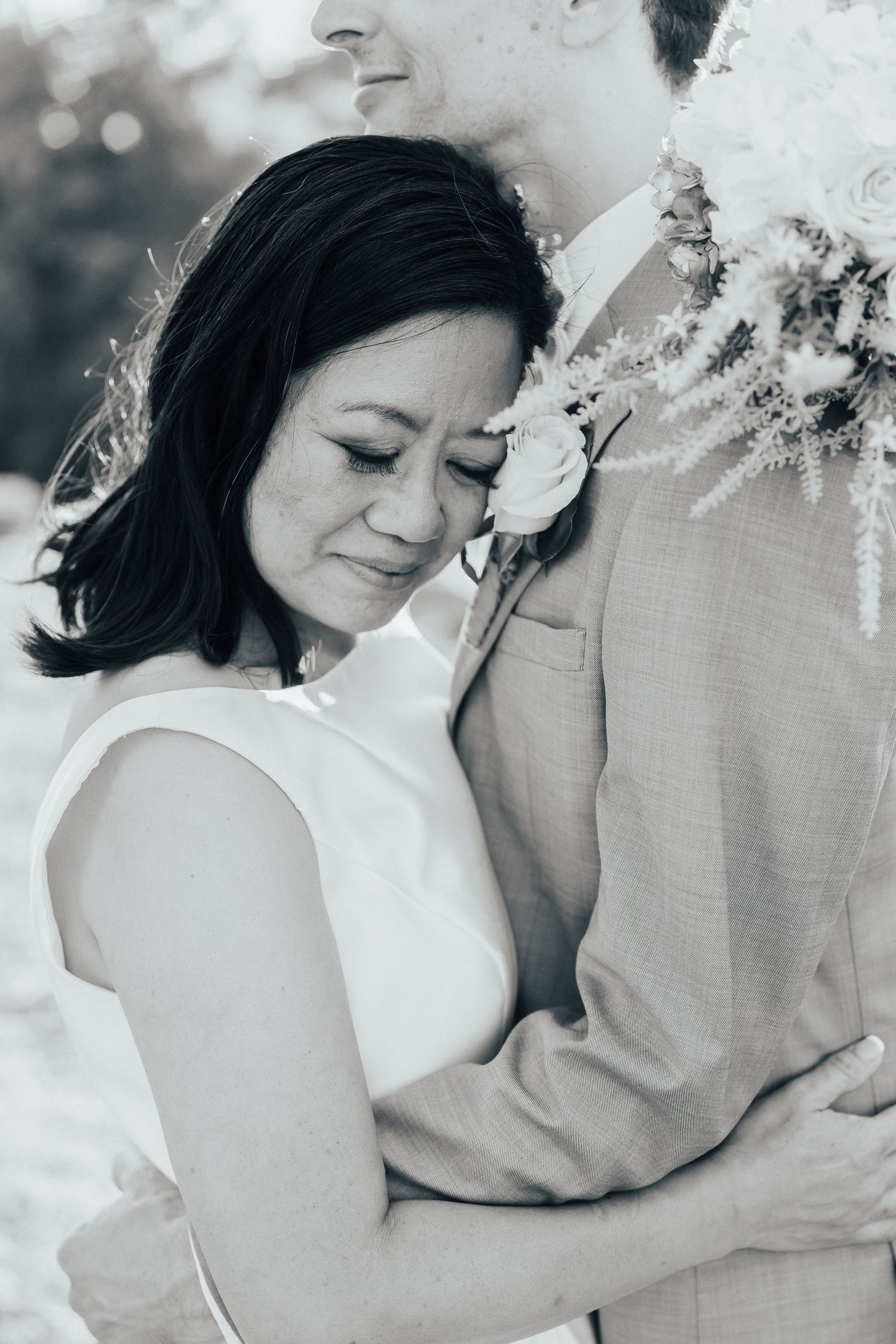 Black and white artistic wedding portraits showing tender embraces.