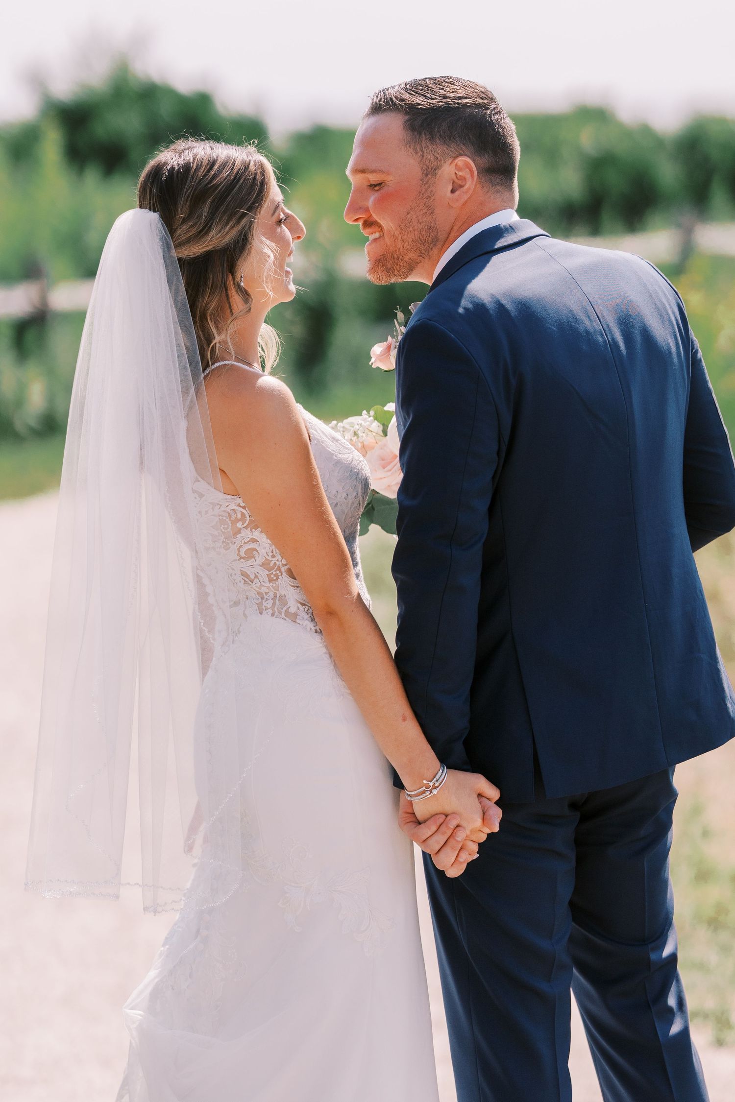 A bride and groom share intimate moments outdoors in a series of candid wedding photos.
