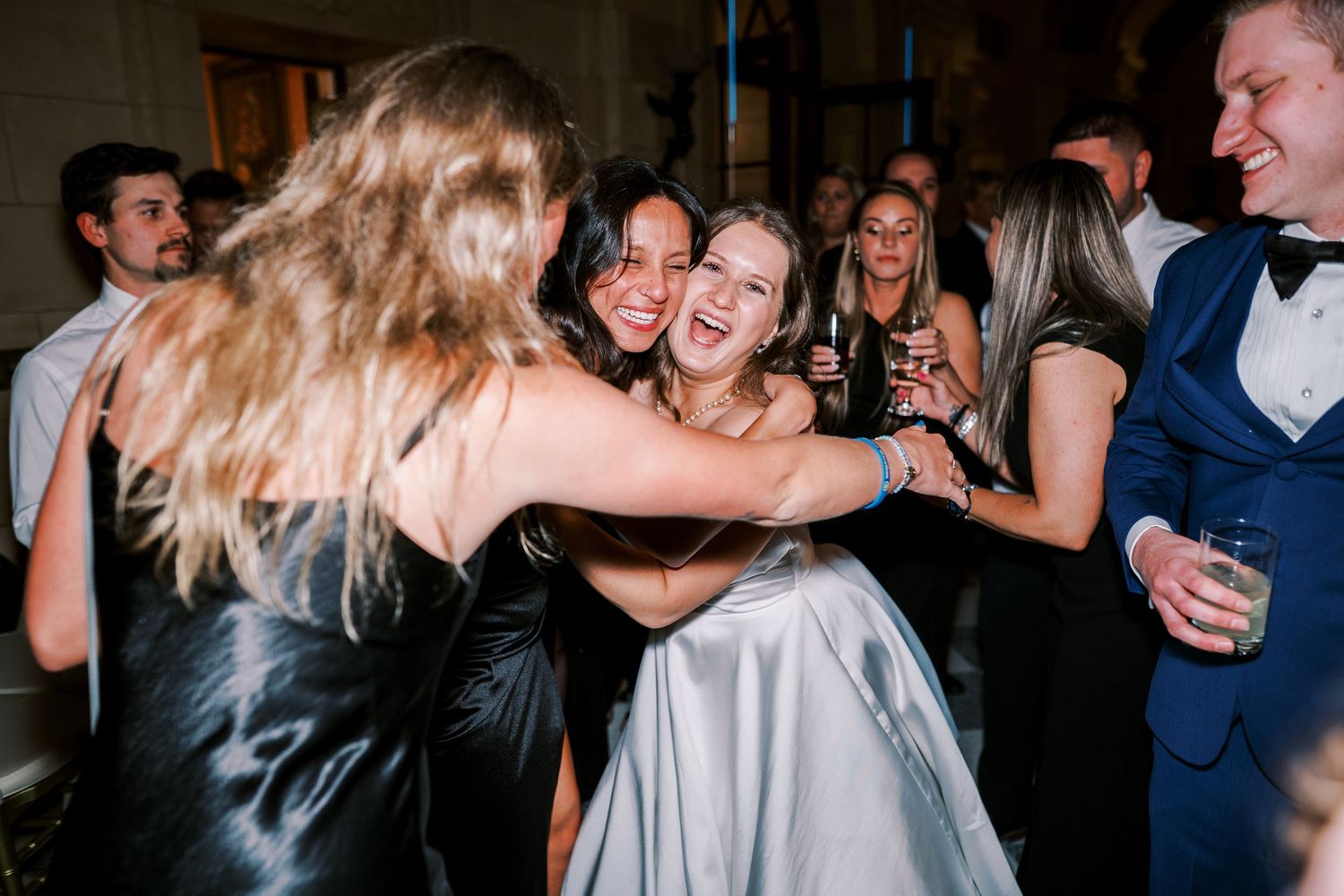 Dance floor filled with party guests enjoying themselves at an evening celebration.