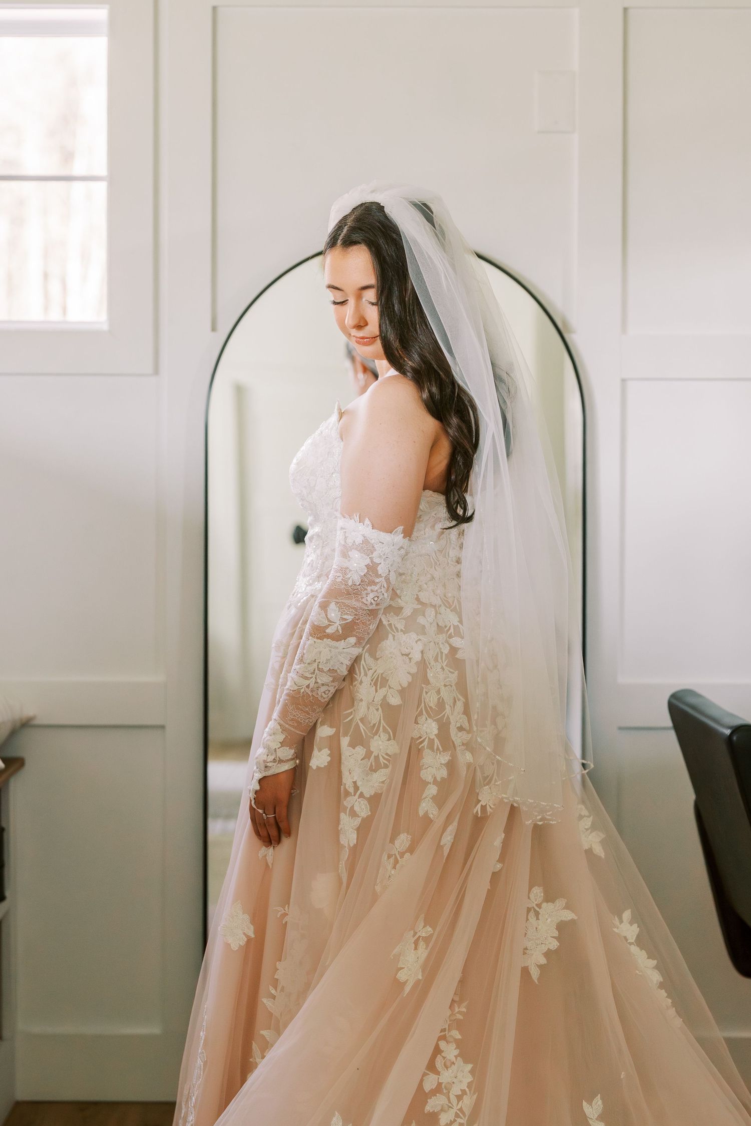 A dreamy bridal portrait series showing a romantic blush pink wedding gown with delicate lace appliques and flowing veil.