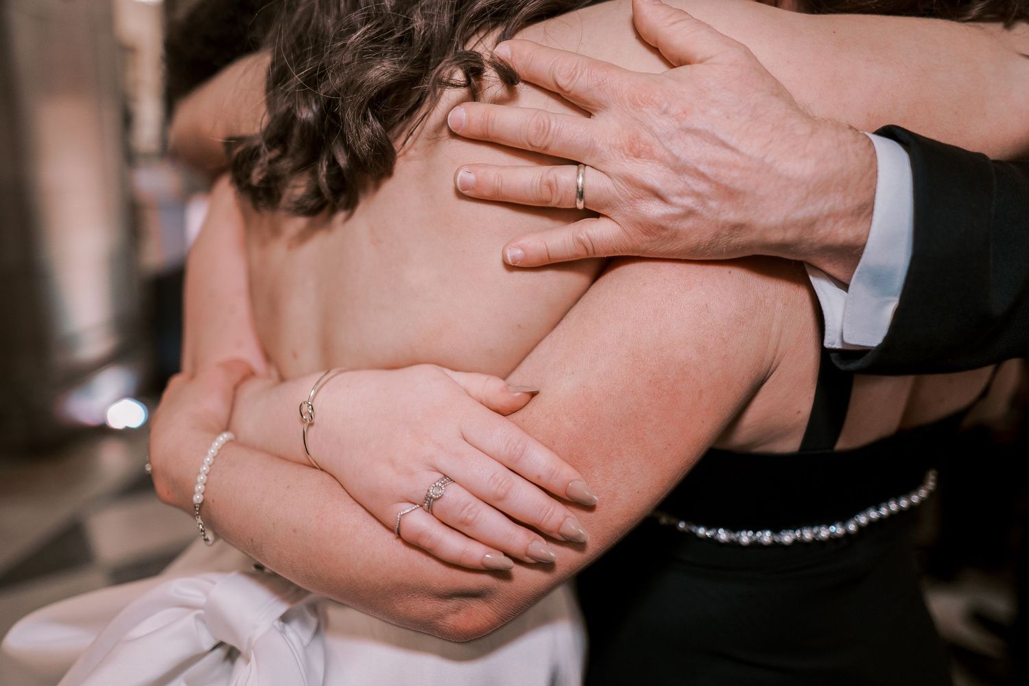 Close-up shots of embracing couples during romantic wedding dance moments.