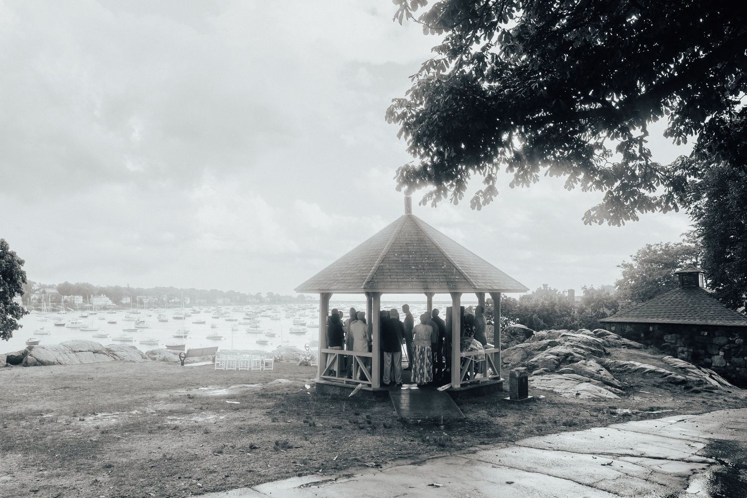 Panoramic sequence of vintage black and white landscape photographs with a gazebo.