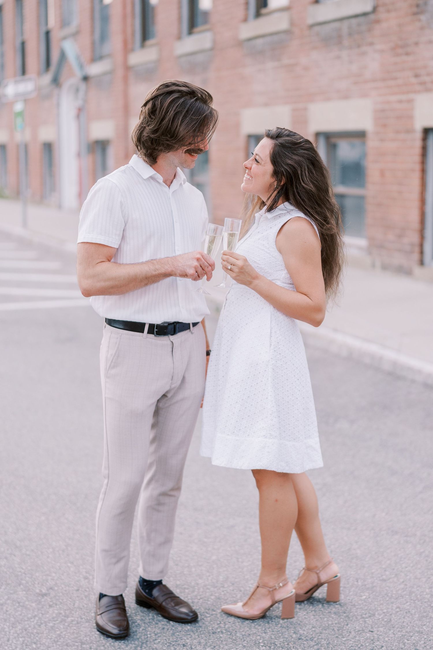 Romantic dance sequence showing close-up of couple's feet as they dance on a brick pathway.