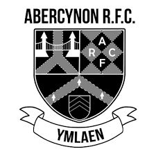 Black and white shield logo for Abercynon RFC with bridge and chevron symbols.