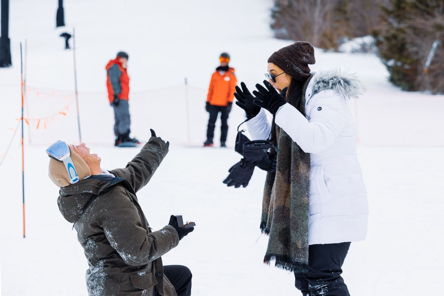People playing and having fun in a snowy winter landscape.