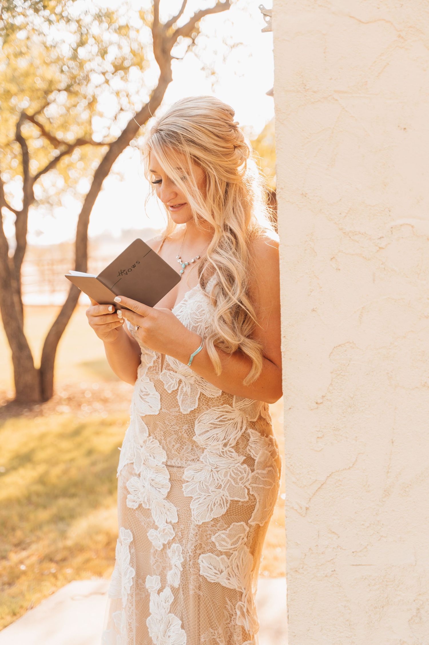 A bride reading from a book, preparing for her vows