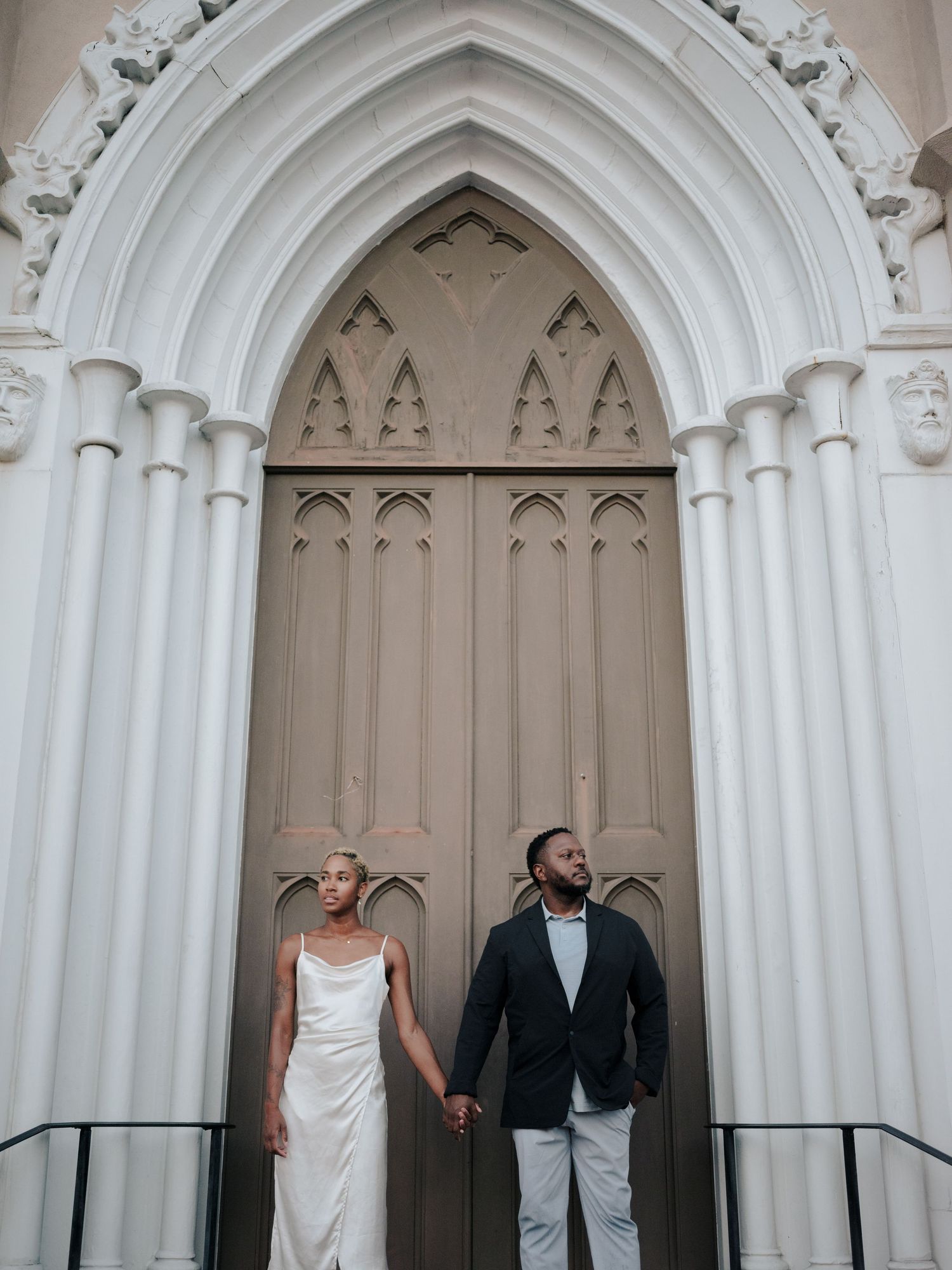 Elegant couple poses in front of three Gothic arched church doorways in a romantic wedding photo sequence.