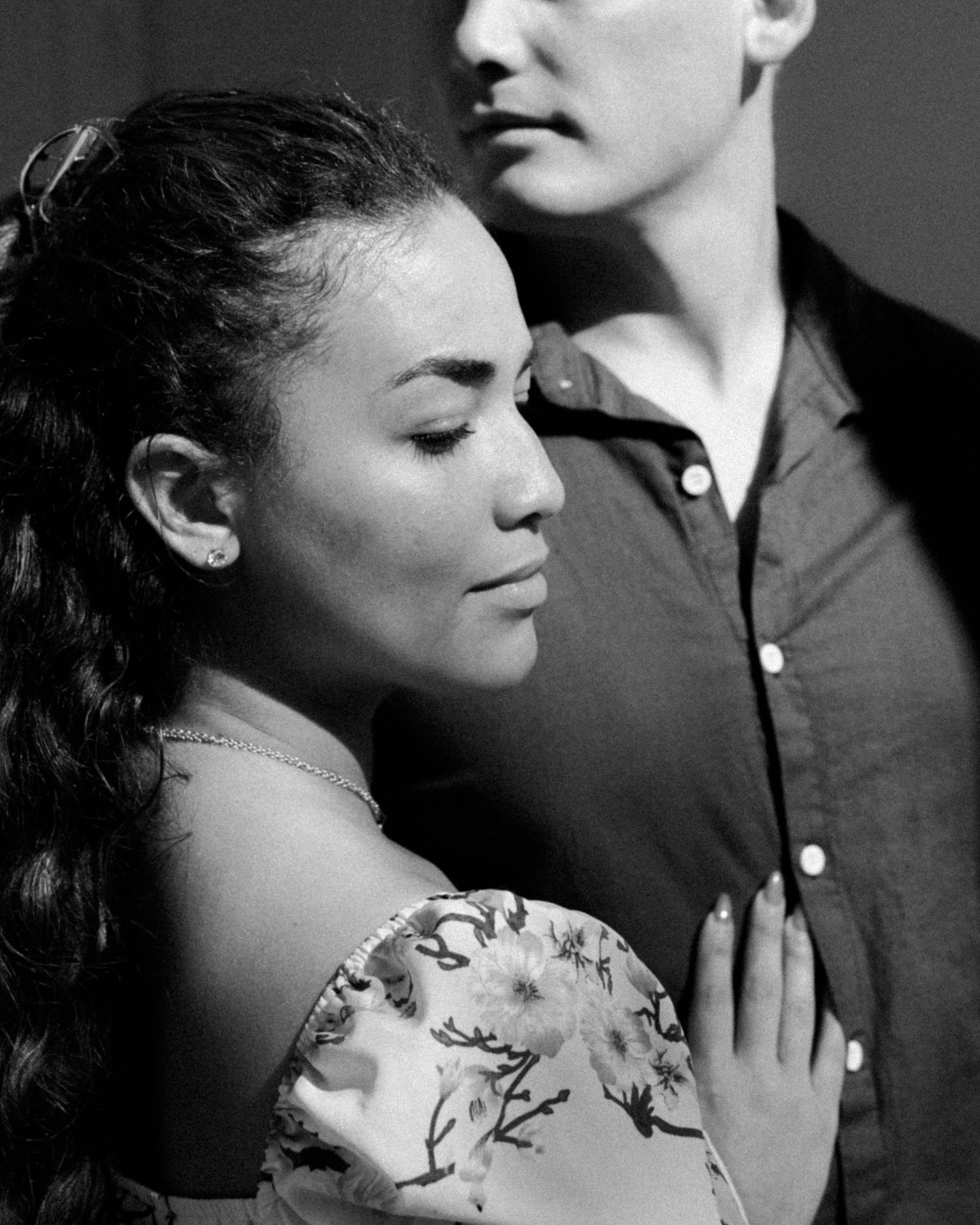 Black and white romantic portrait series showing intimate moments between a couple in vintage-inspired poses.