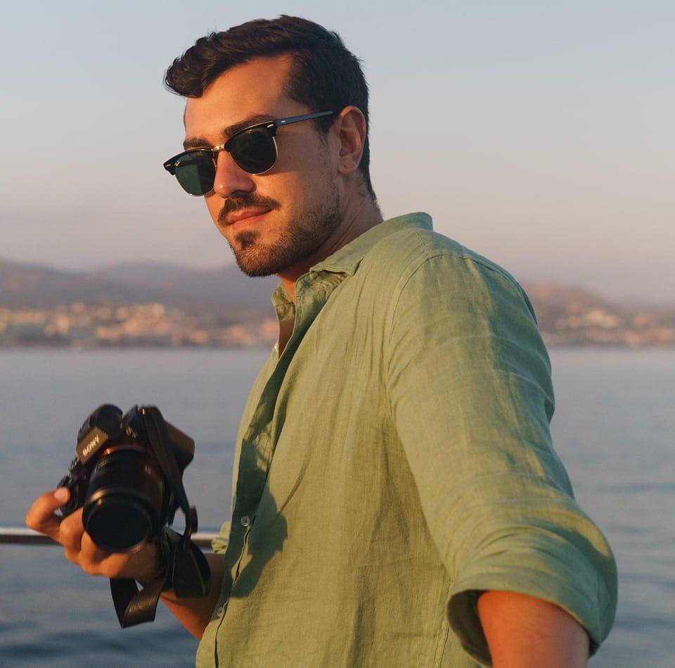 Candid portrait of photographer at sunset – behind-the-scenes Azores wedding storytelling