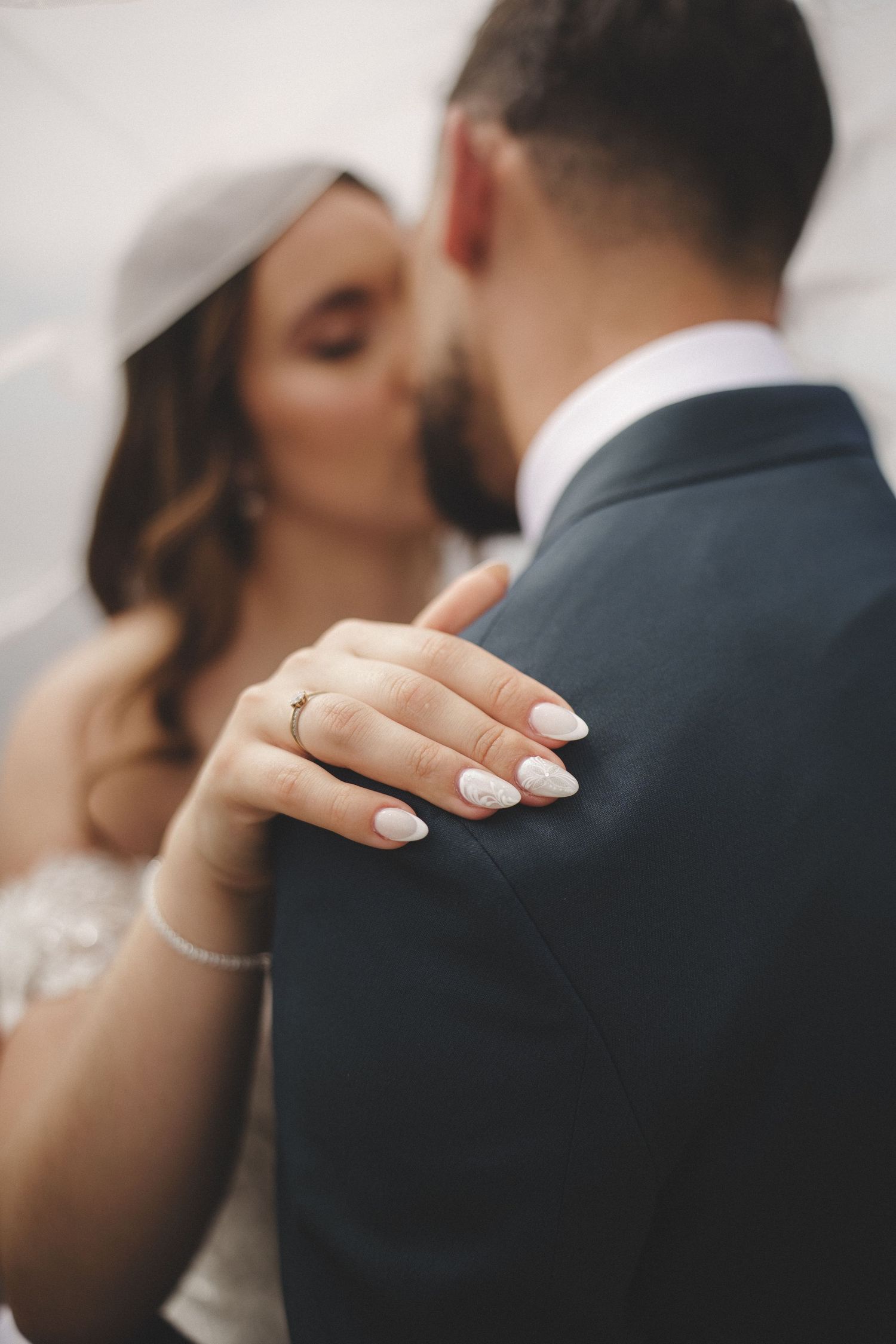Bride touches groom’s shoulder during intimate moment – destination wedding in the Azores