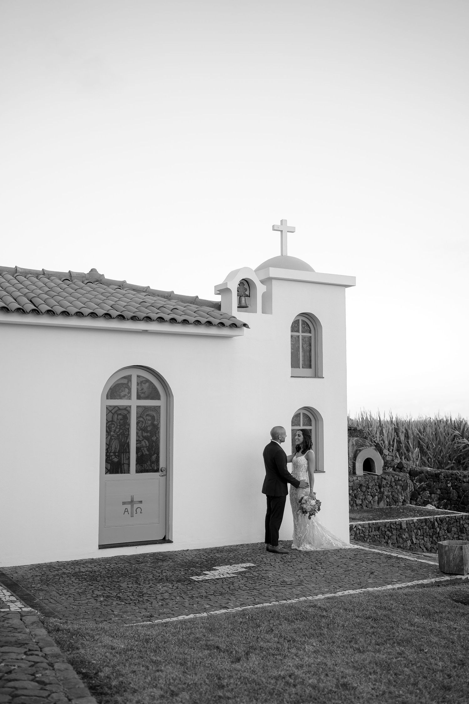 Black and white photo of couple in front of chapel – timeless Azores elopement
