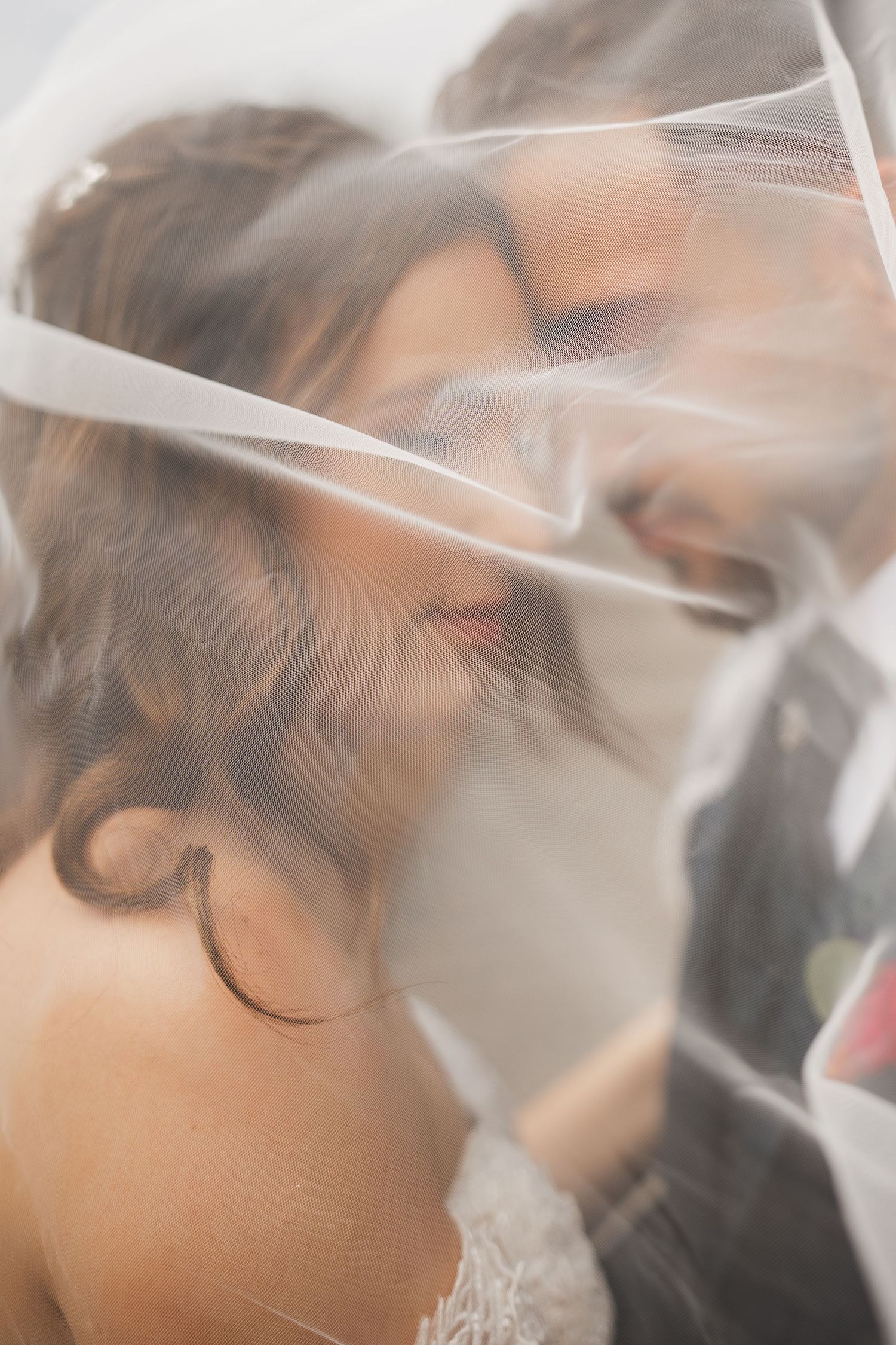 Joyful newlyweds under veil – raw wedding emotion captured in São Miguel, Azores