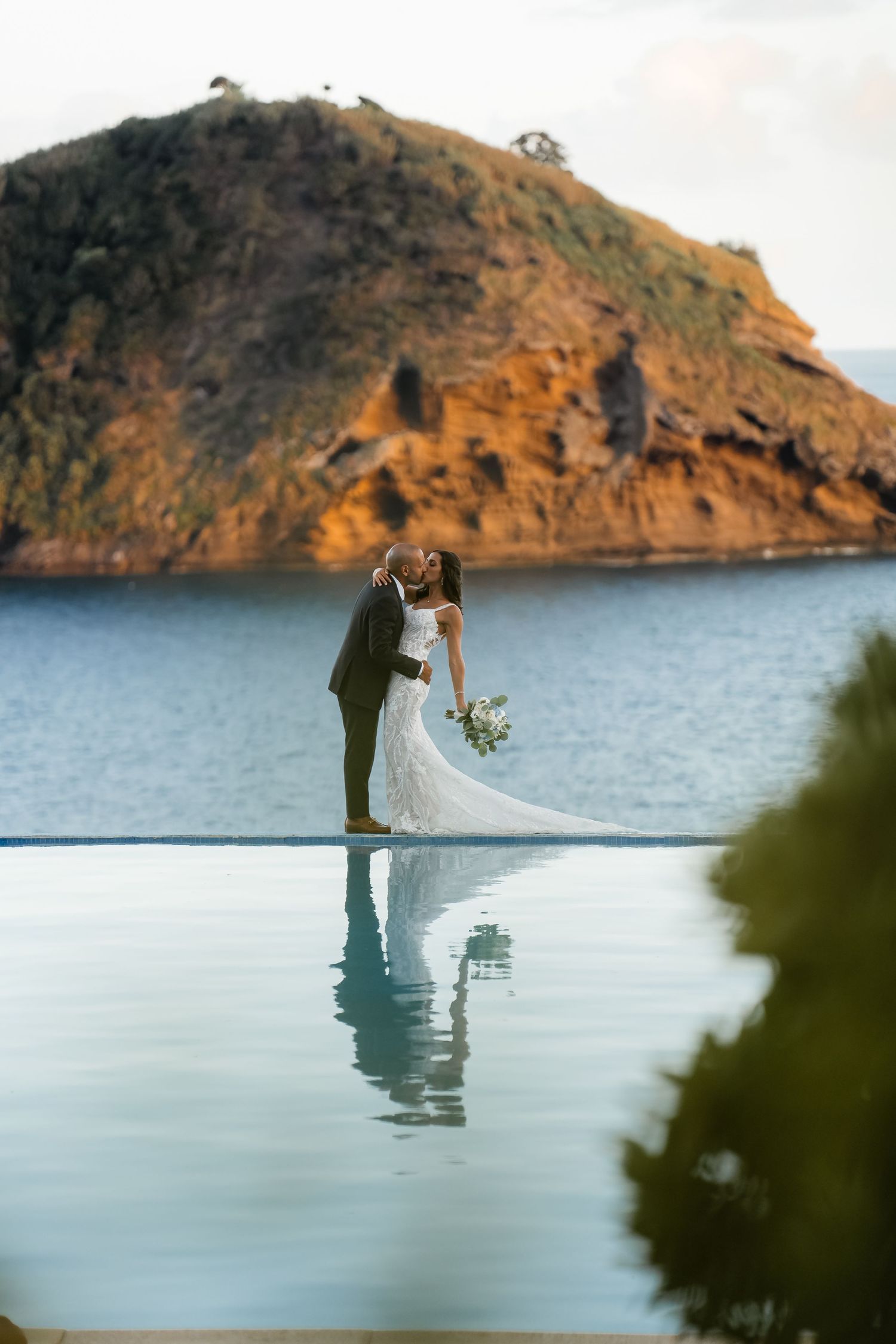 couple reflected on still lake waters – serene elopement in Azores captured by São Miguel wedding photographer