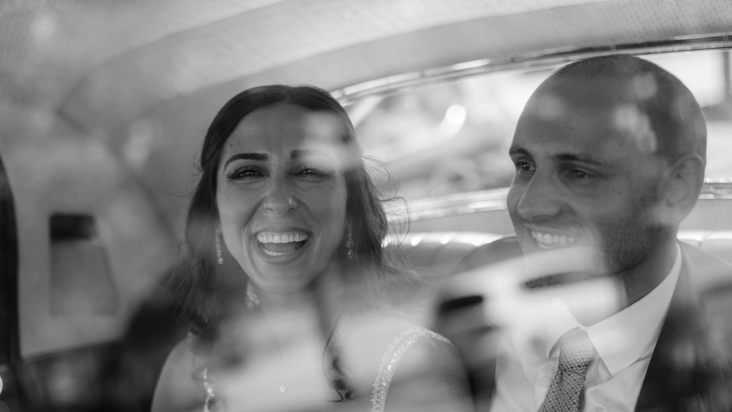 Candid laughter inside wedding car – emotional moment photographed in São Miguel, Azores
