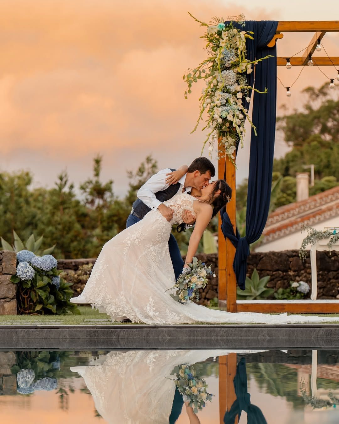 Bride and groom on rooftop with sunset tones – cinematic São Miguel wedding photography