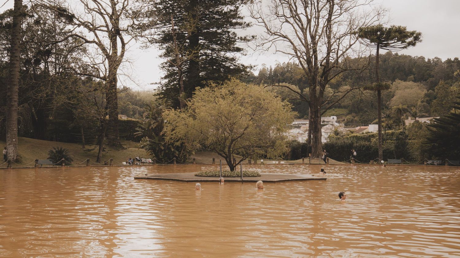 Six panoramic images showing a suburban park or open space submerged in rising floodwaters.