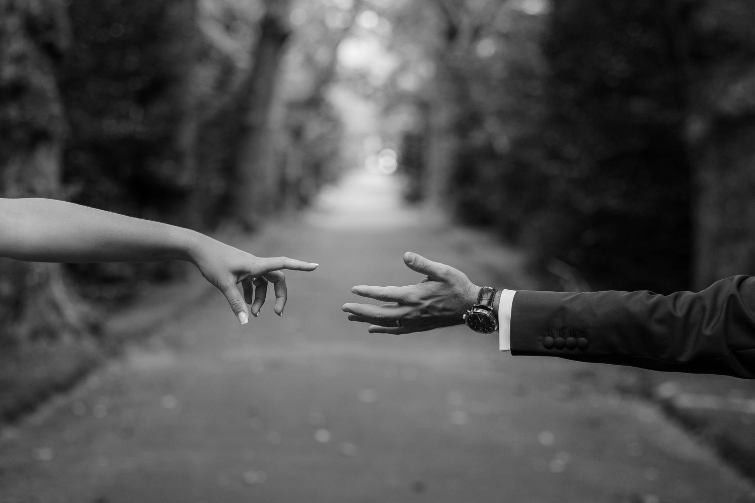 Black and white emotional hands reaching – symbolic wedding moment captured in the Azores