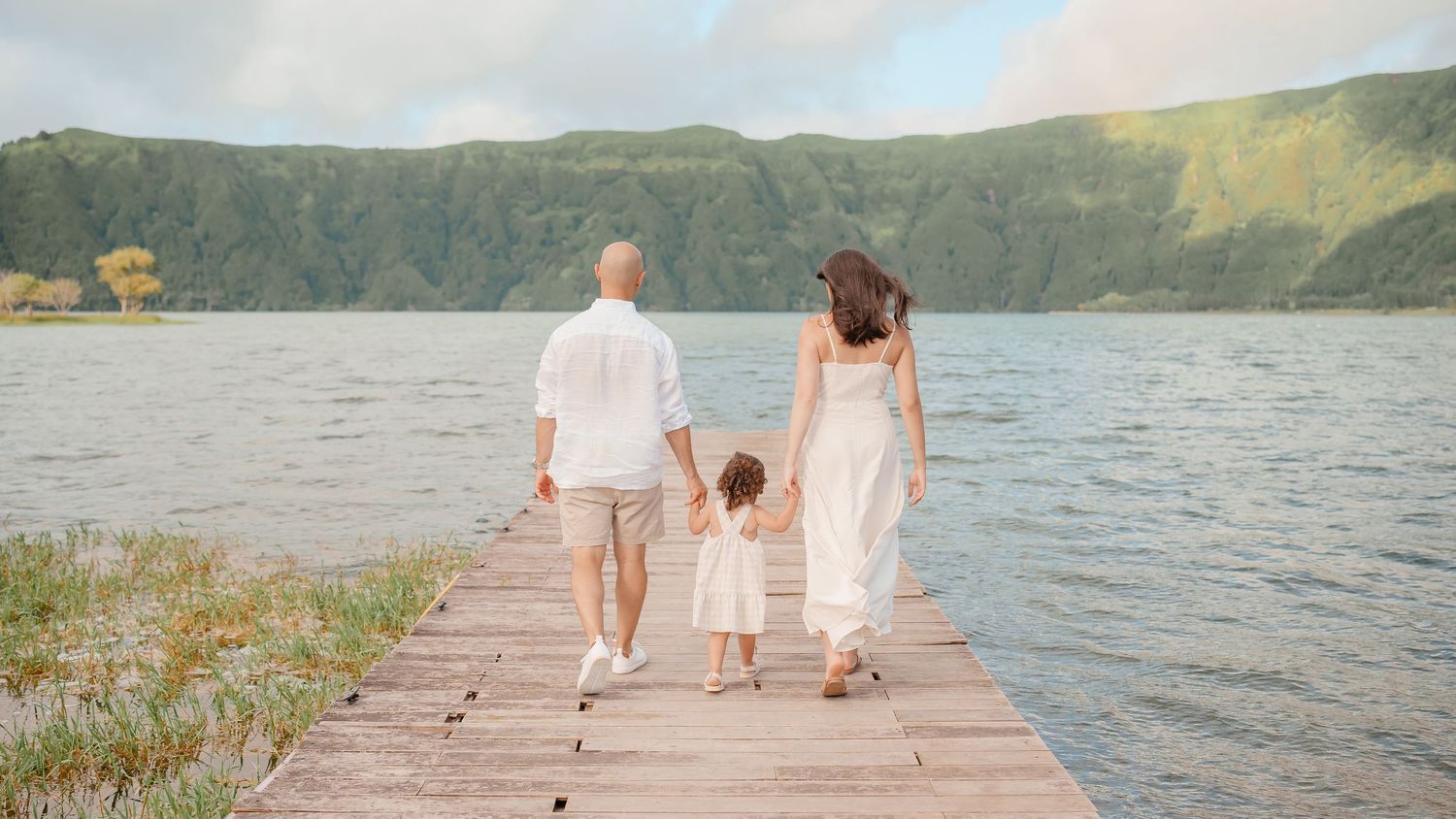 Family walking on dock at Sete Cidades lagoon – lifestyle wedding photo in São Miguel