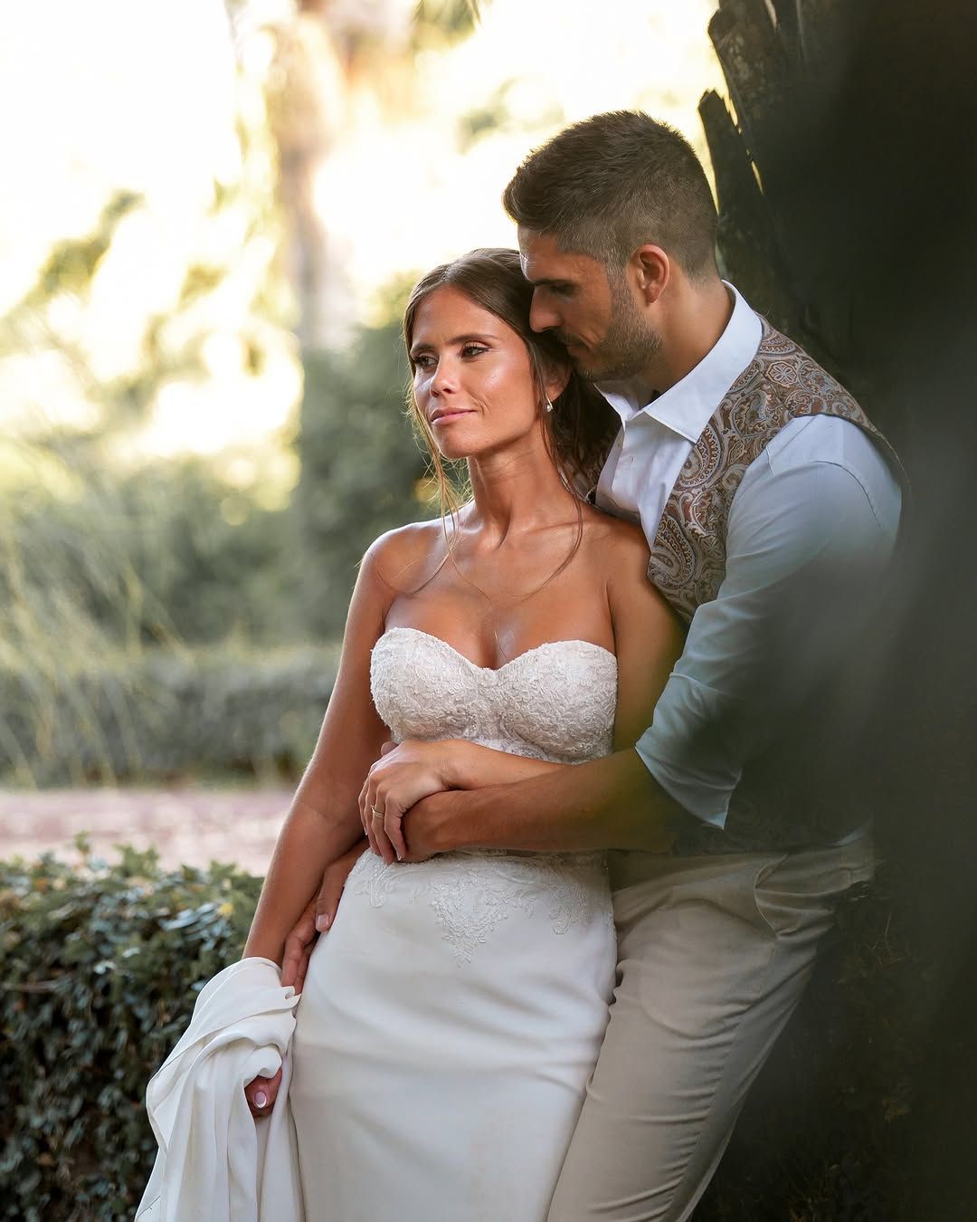 Bride and groom holding each other in golden light – Azores wedding photographer capturing love