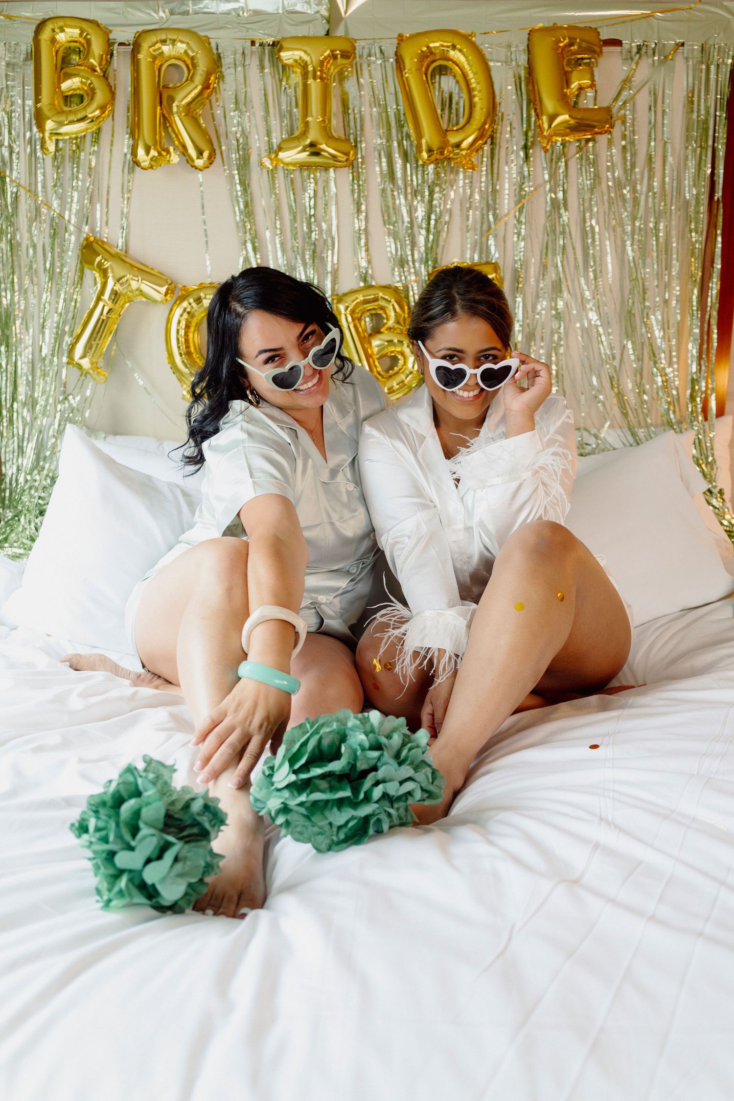 Wedding preparation scene with sunglasses and mint green tulle decorations.