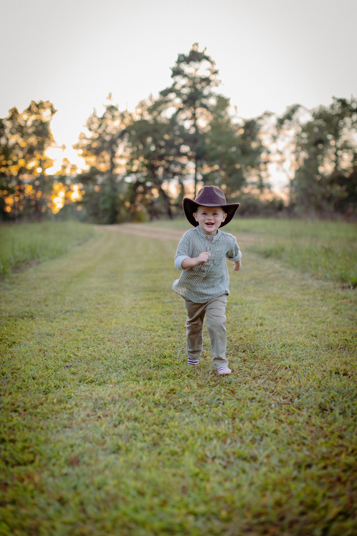 Sequence of photos showing a child running across a grassy field at sunset with trees in the background.