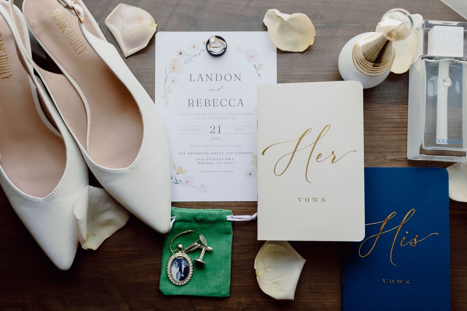 Wedding details flatlay with invitations, shoes and floral elements.