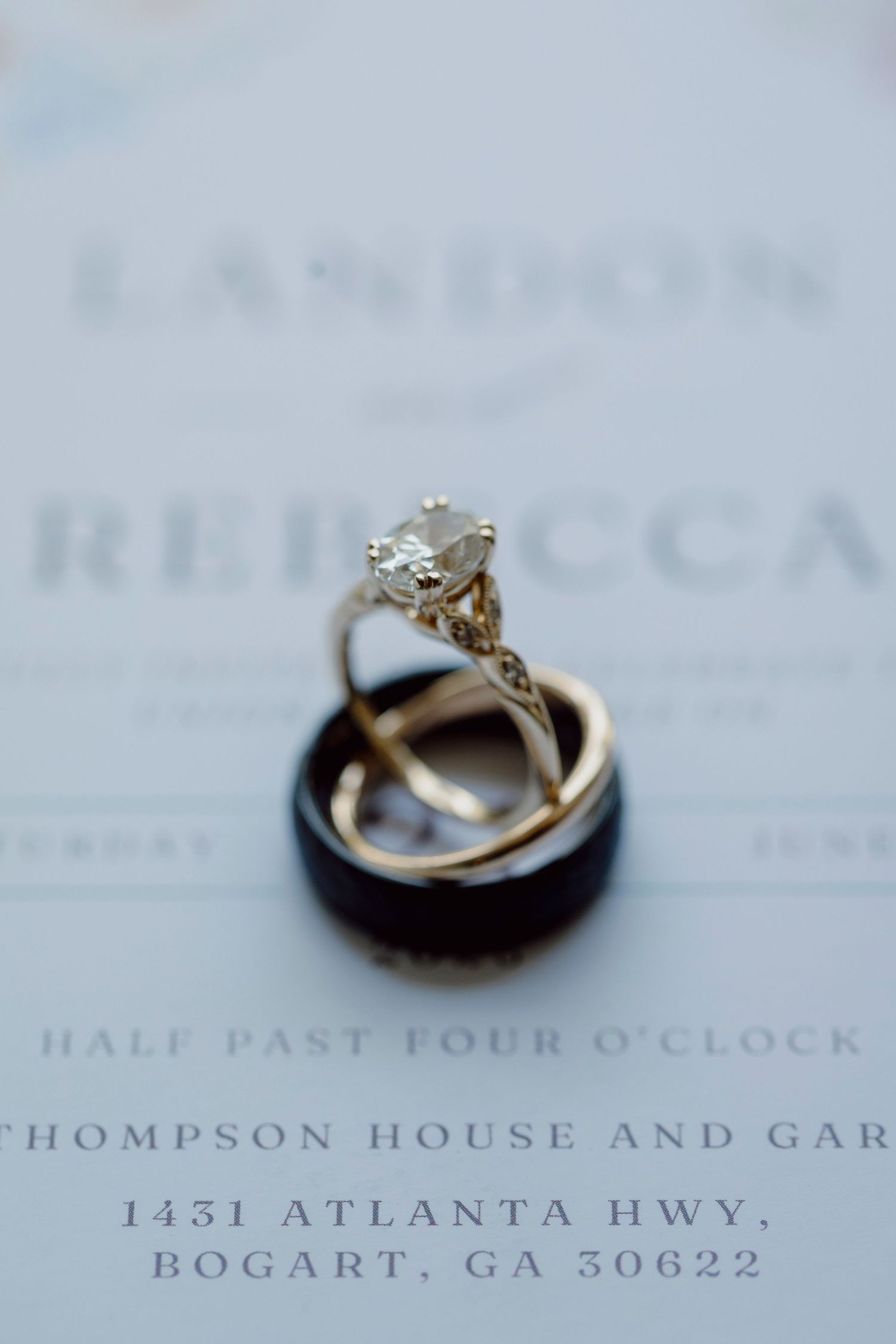 Wedding invitation details showing venue address at Thompson House and Gardens in Bogart, GA.