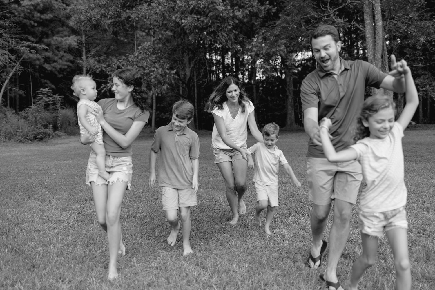 Family photography, joyful, playing.