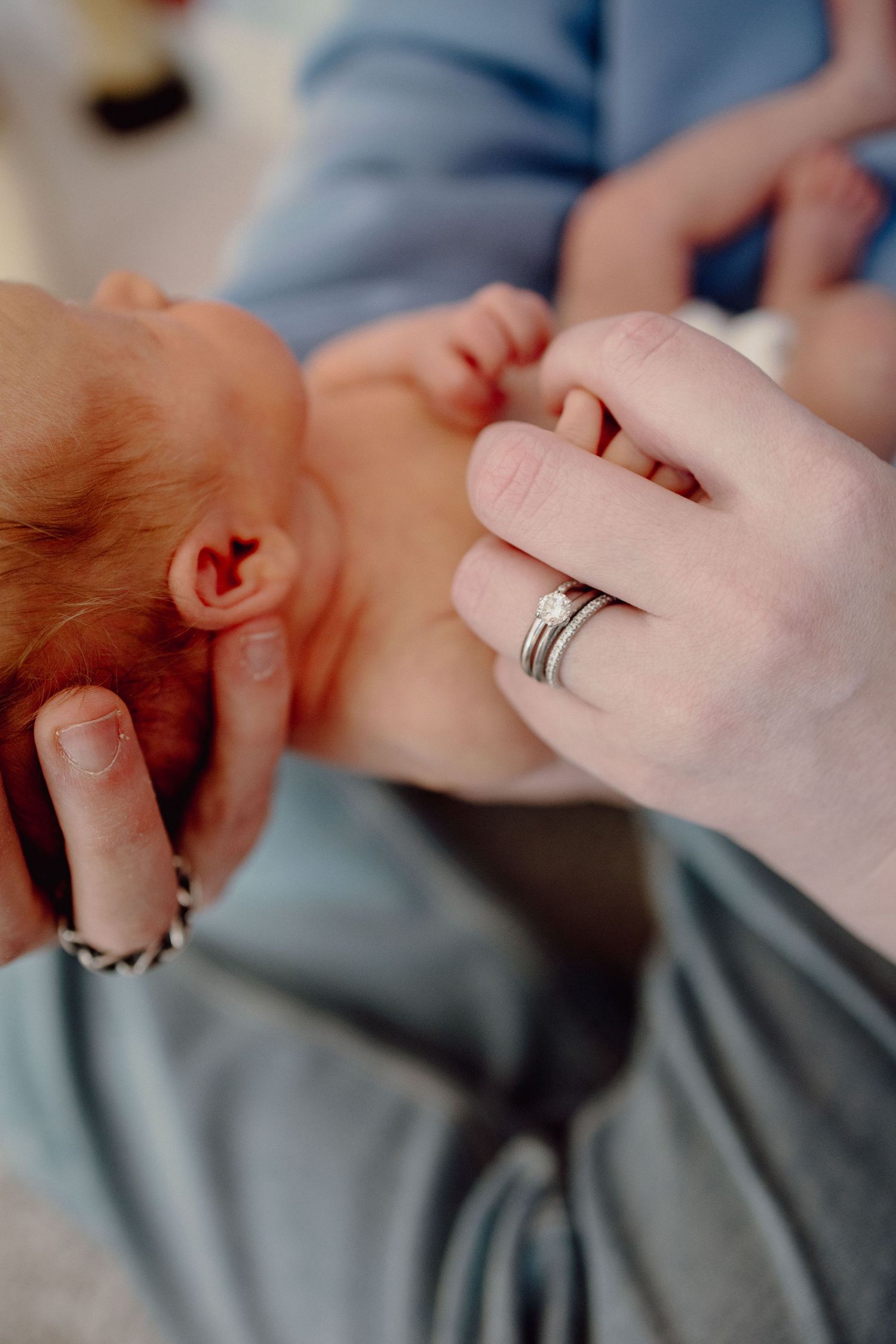 A close-up series of images showing a sleeping baby in soft focus with gentle lighting and muted tones.