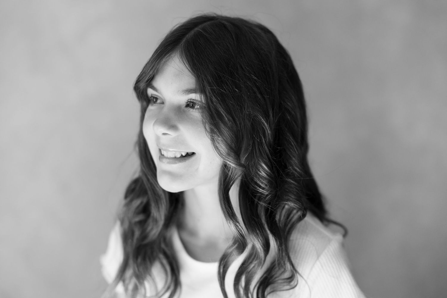 Black and white portrait series with natural lighting and soft expressions.